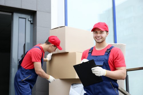 Careful furniture moving in a Bow flat with stair and access planning