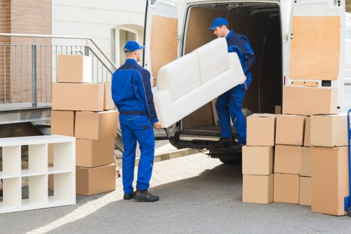 Local removal team planning a move in Bow with boxes and furniture