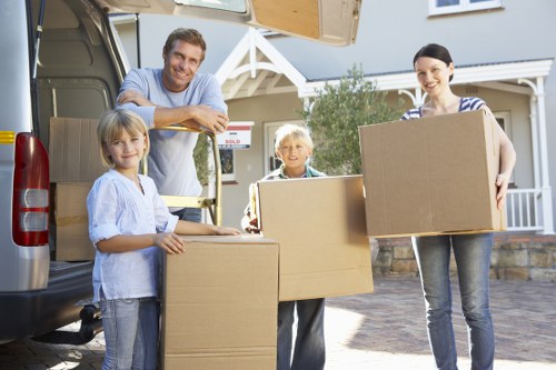 Furniture and boxes loaded into a van for a Bow collection