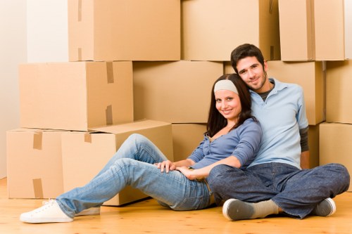 Packed boxes and household furniture ready for removals in Bow