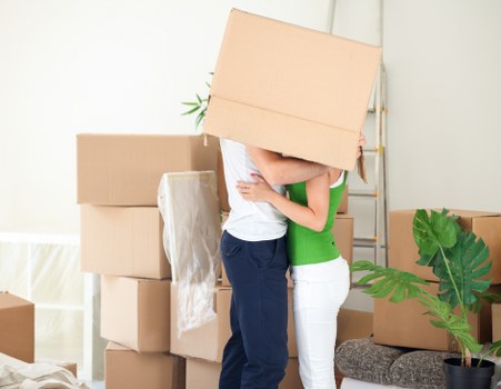 Commercial office furniture and boxes prepared for transport in Bow