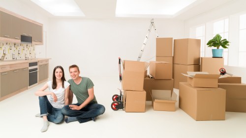 Careful unloading of household items for a Bow delivery