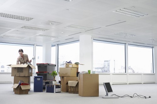 Mover wearing PPE while carrying furniture carefully