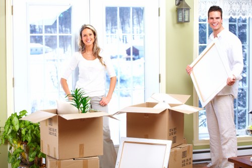 Unpacking boxes in a Bow property after moving day